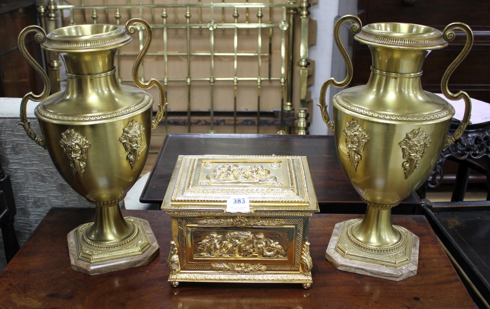 An ornate Italian gilt metal casket, 29cm and a pair of gilt metal vases on onyx plinths, height 49cm